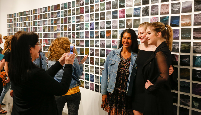 Woman looking at art