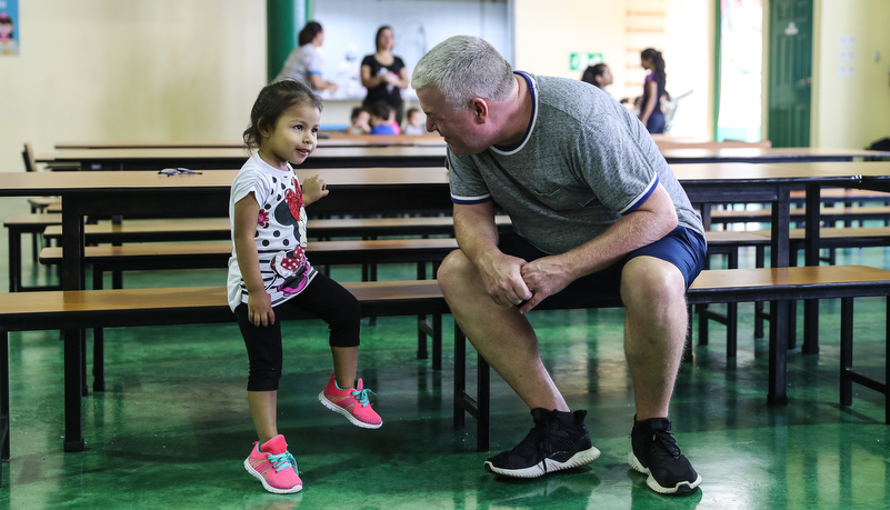 the trainer talks with a child