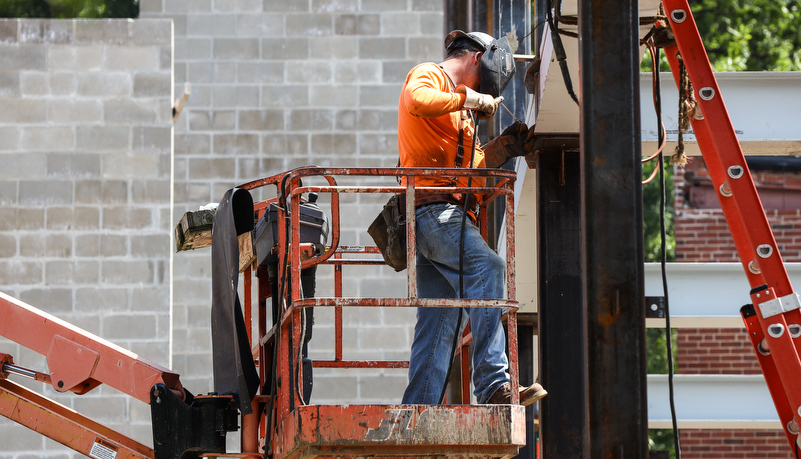 iron workers welding beams