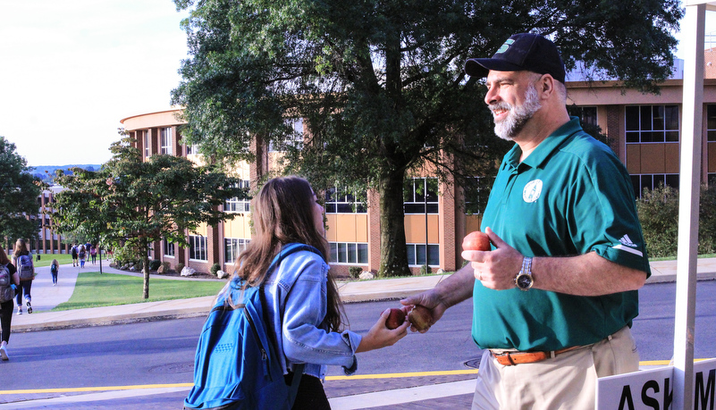 President Behre handing out morning snacks