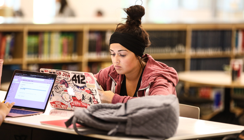 woman studying in the library