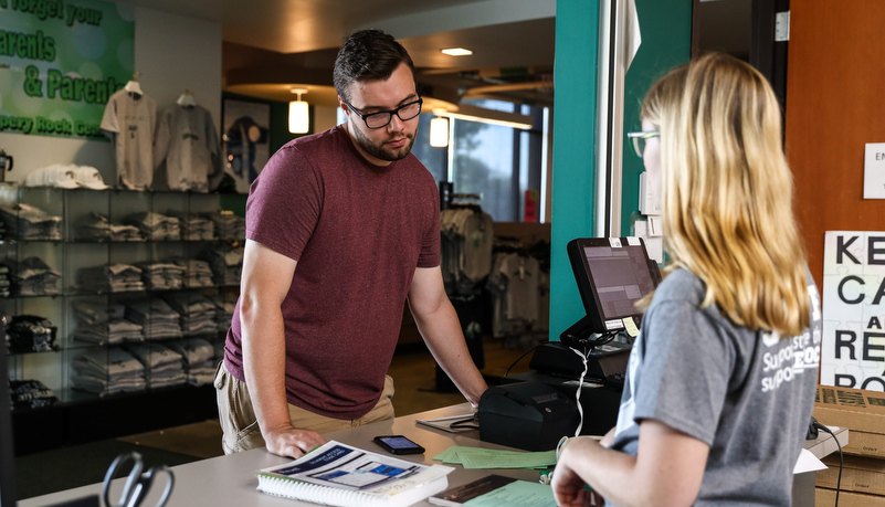 Student getting his books from the bookstore