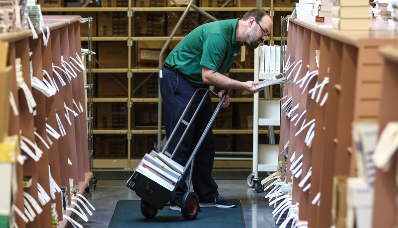 Bookstore worker picking orders