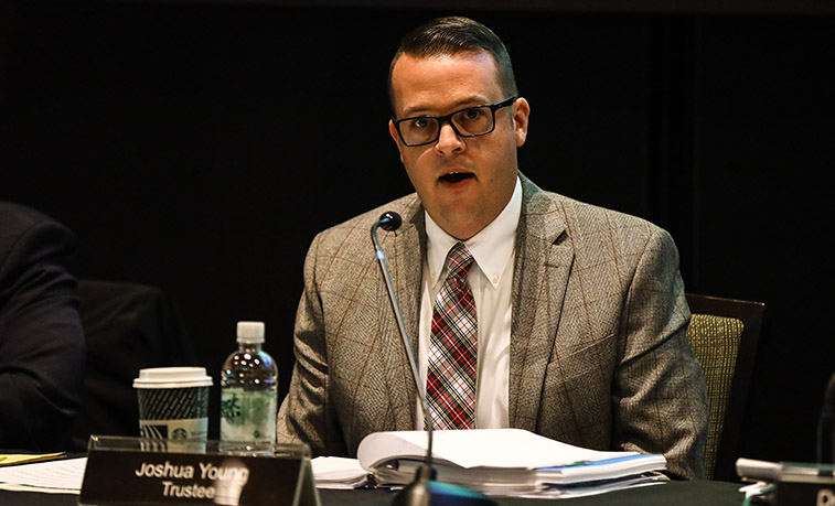 Slippery Rock University trustee Joshua Young addresses other members of the council during the Dec. 13 quarterly business meeting.