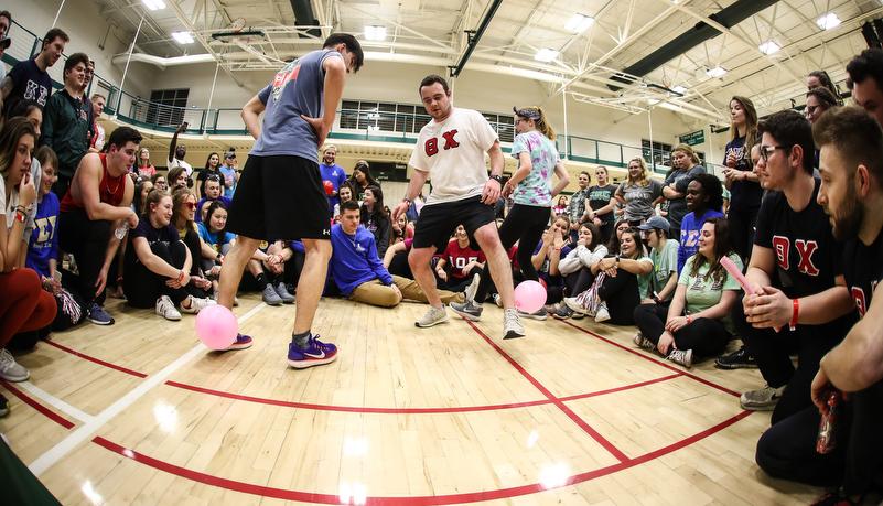 students cheer on their team representative