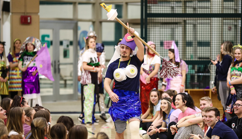 students participat in a trash fashion show