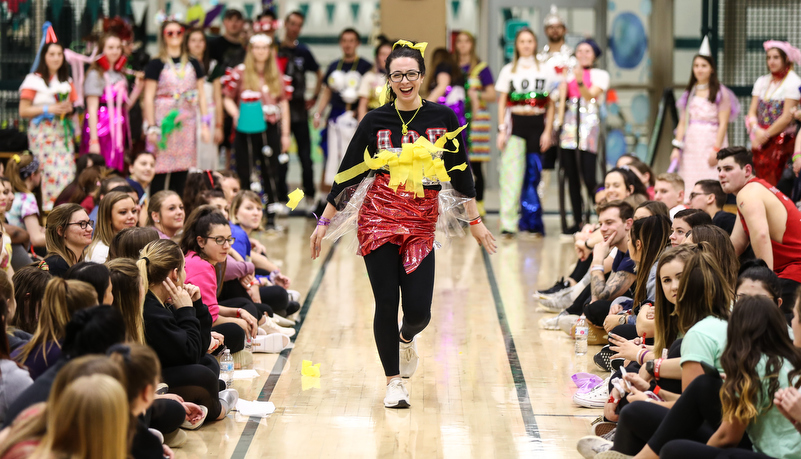 students participat in a trash fashion show