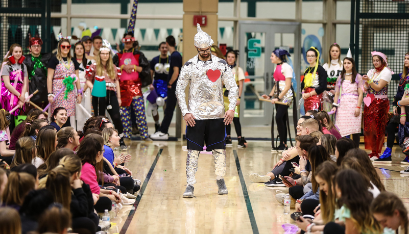 students participat in a trash fashion show
