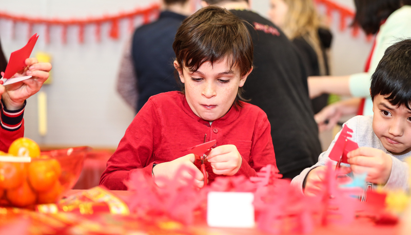 Child making Chinese crafts