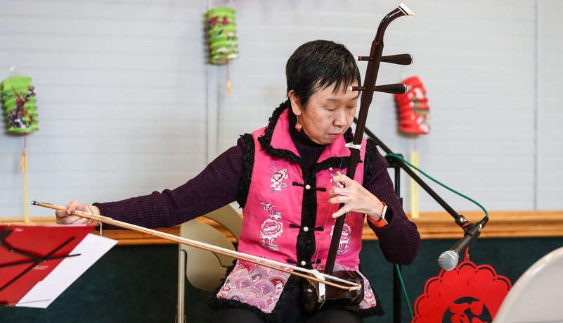 Woman playing traditional instrument