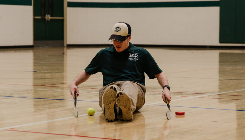 Man playing sled hockey