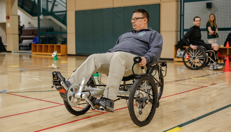 Man trying an accessable bike