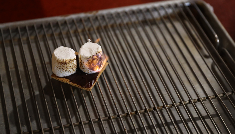 Two marshmallows almost prepared