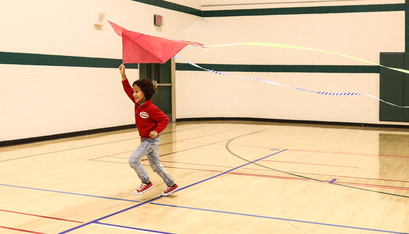 Child playing with a kite