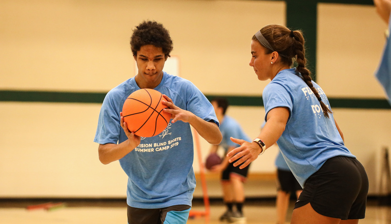 Camper playing basketball