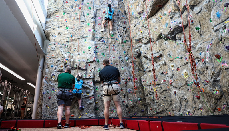 Campers climbing the wall