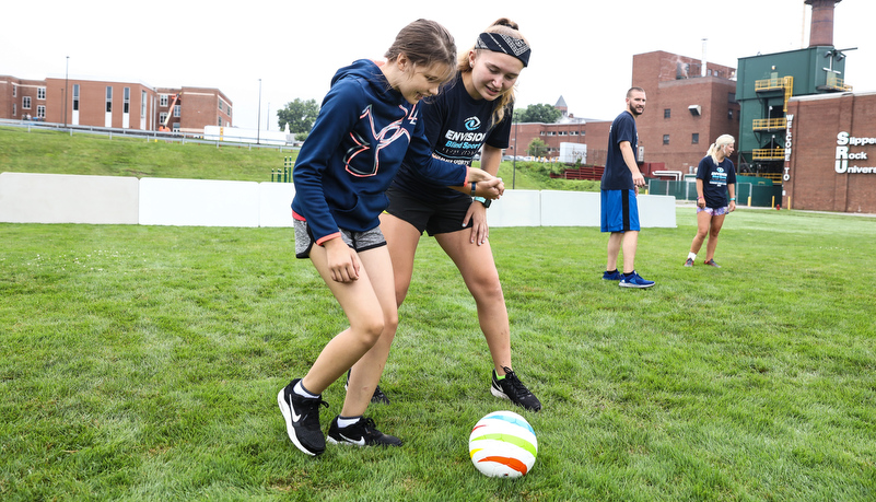 Camper playing soccer