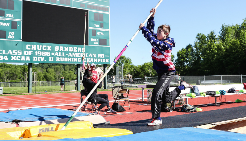 students practicing pole vaulting