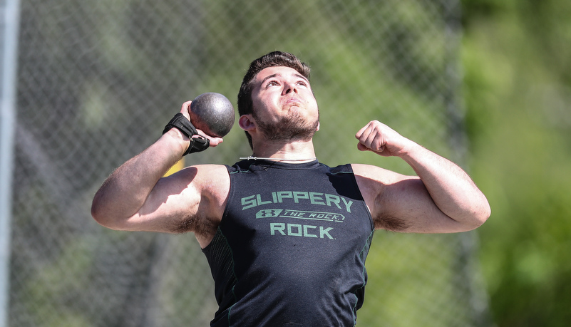 boy throwing a shot putt