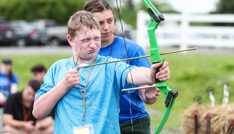 Camper shooting an arrow