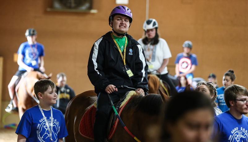 Camper riding a horse