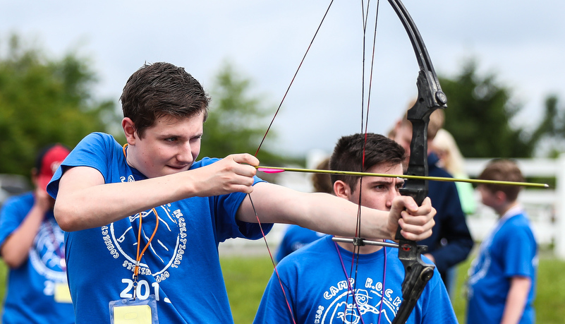 Camper shooting an arrow