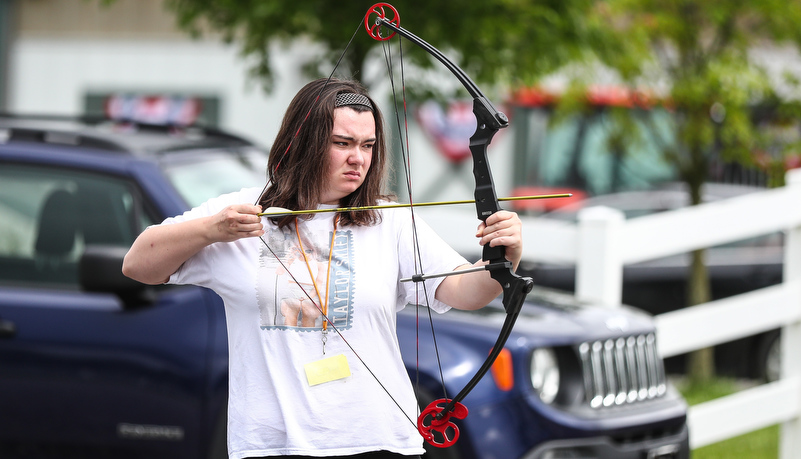 Camper shooting an arrow