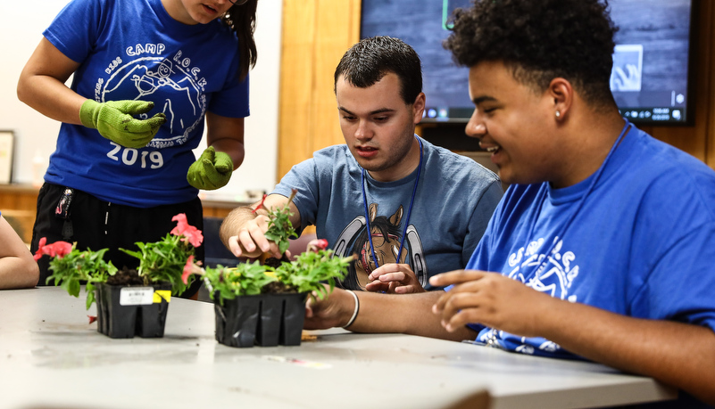 campers planting flowers 