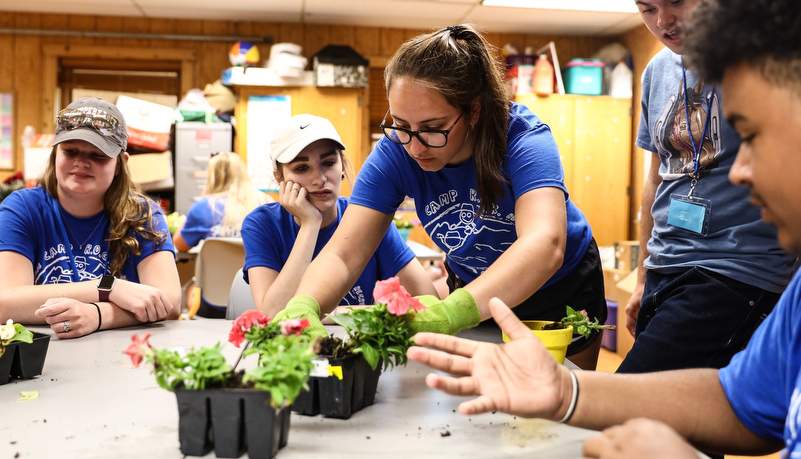 campers planting flowers