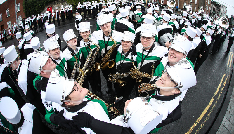 Saxophones pose for a photo