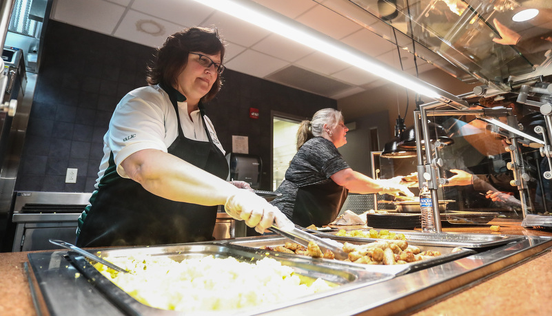 students being served food