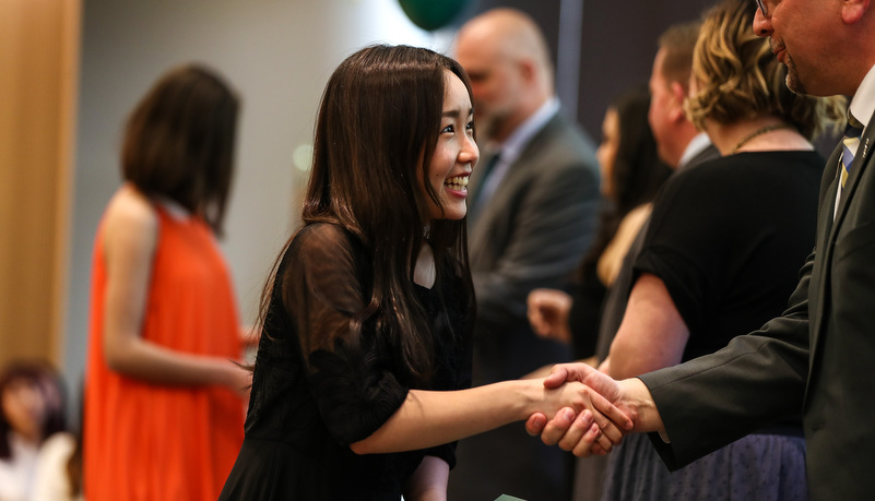 student receives her certificate