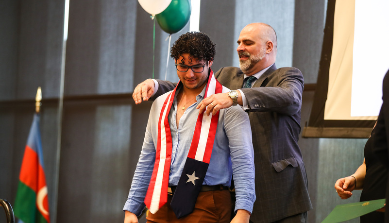 student receives his stoles