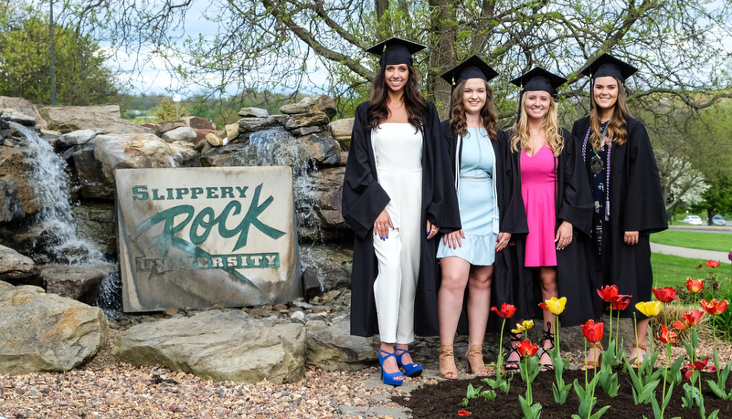 Graduates pose for a photo