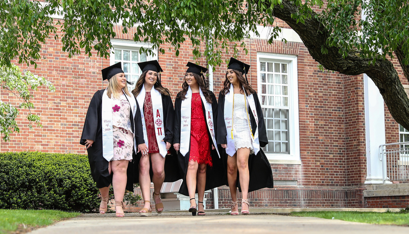 Graduates pose for a photo