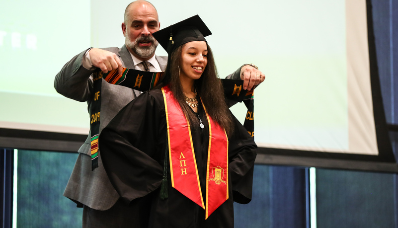 a woman receives her stoles