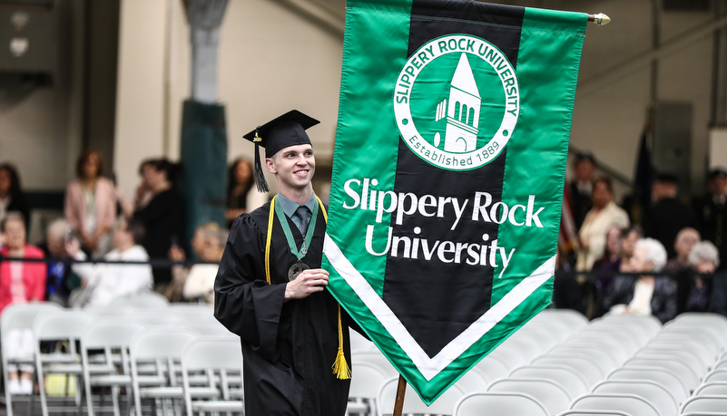 man carries a banner