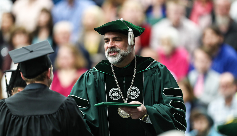 President hands out a diploma