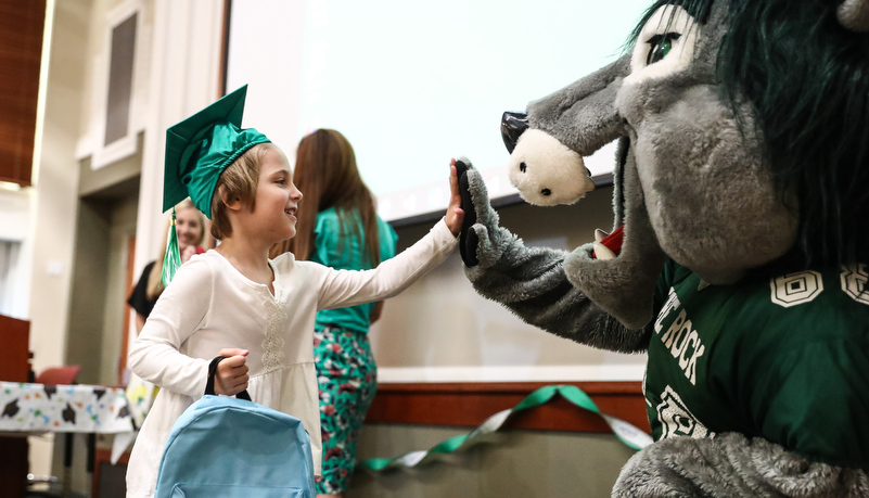 Girl gives Rocky a high five