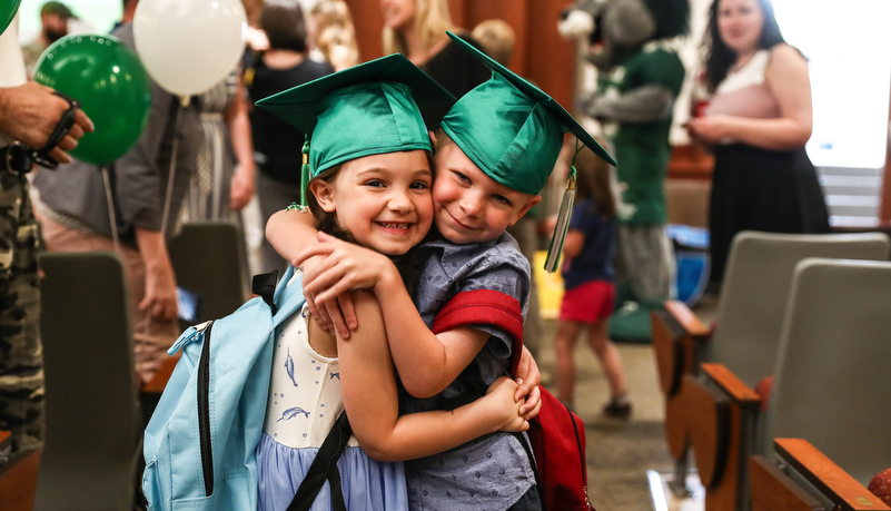 classmates hug