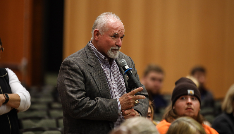 a member of the audience asks a question