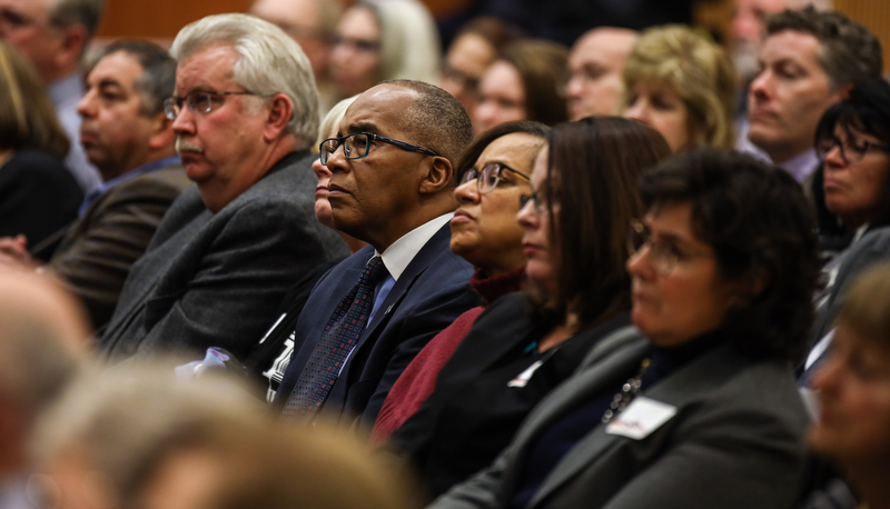 a member of the audience asks a question