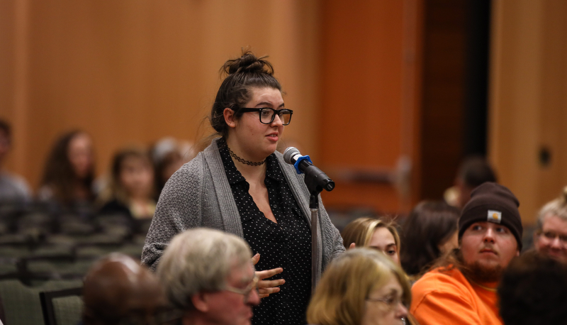 a member of the audience asks a question