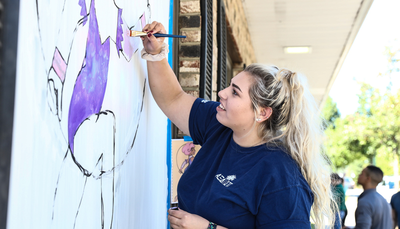 Student's painting indows on main street