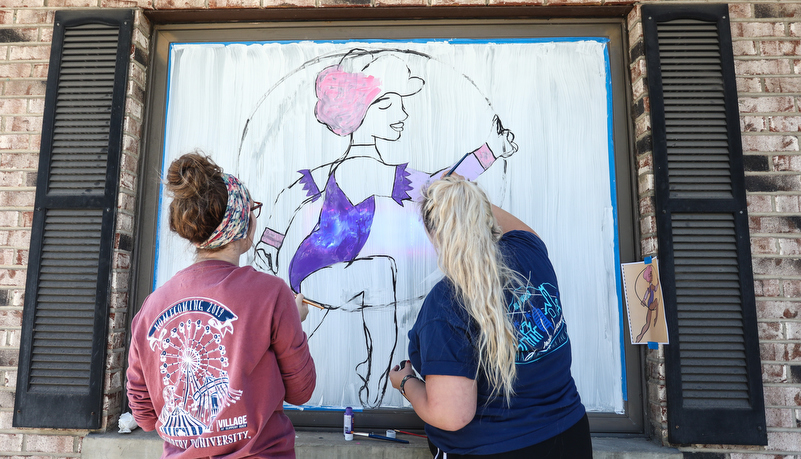 Student's painting indows on main street