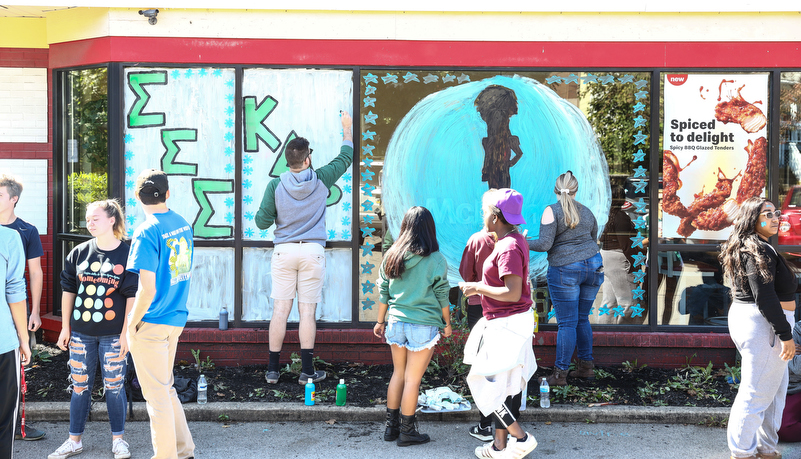 Student's painting indows on main street