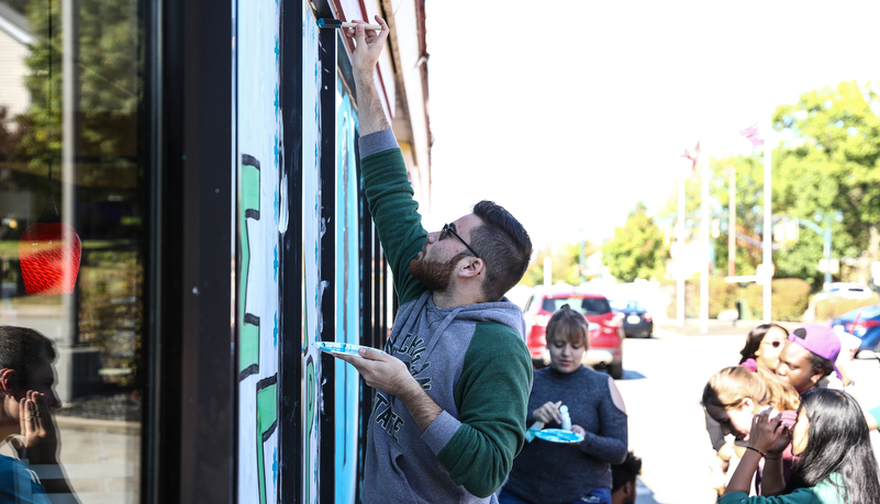 Student's painting indows on main street