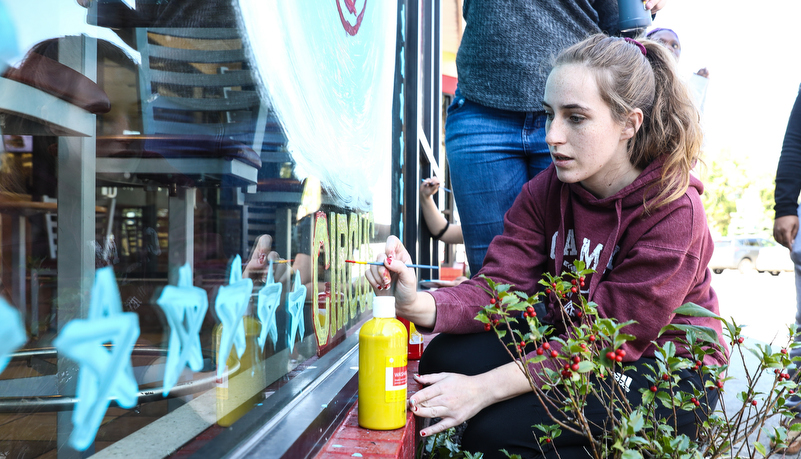 Student's painting indows on main street