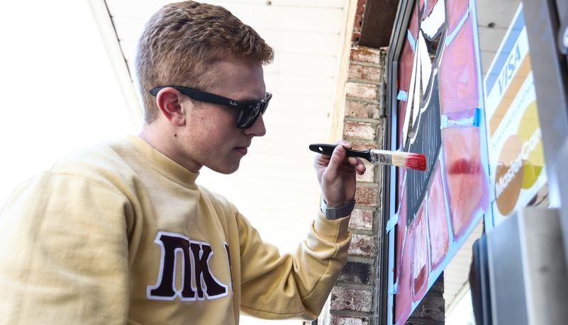 Student's painting indows on main street