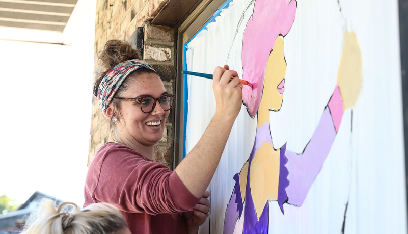 Student's painting indows on main street